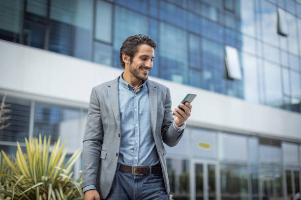 istock Cheerful entrepreneur talking on a mobile phone 1330165653