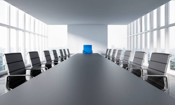 Meeting room in office skyscraper Large conference table with chairs in a meeting room in the high-rise office building, view of the skyline conference table stock pictures, royalty-free photos & images