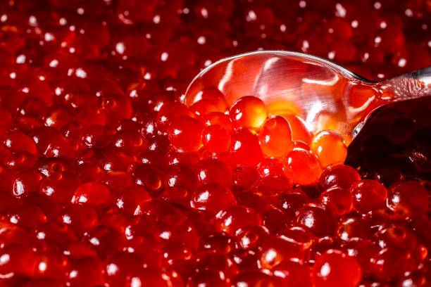 Tasty delicious red soft caviar as background