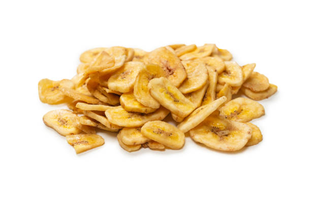 istock Banana chips isolated on a white background. Dehydrated banana. 1330168002