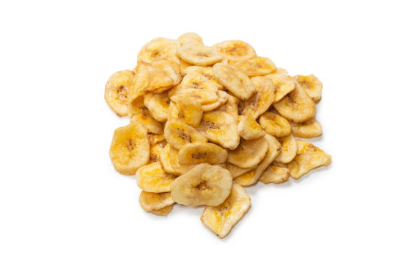 istock Banana chips isolated on a white background. Dehydrated banana. 1330168006