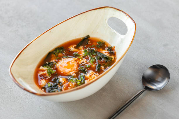 istock Asian noodle soup in bowl on gray background 1330168094