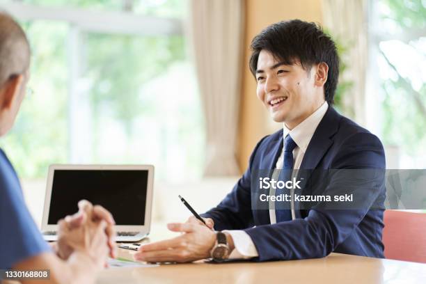 Sales Man Making A Proposal Stock Photo - Download Image Now - Advice, Business, Japanese Ethnicity