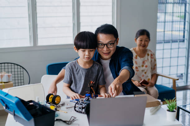 istock Father and son building a robot toy together at home 1330170832