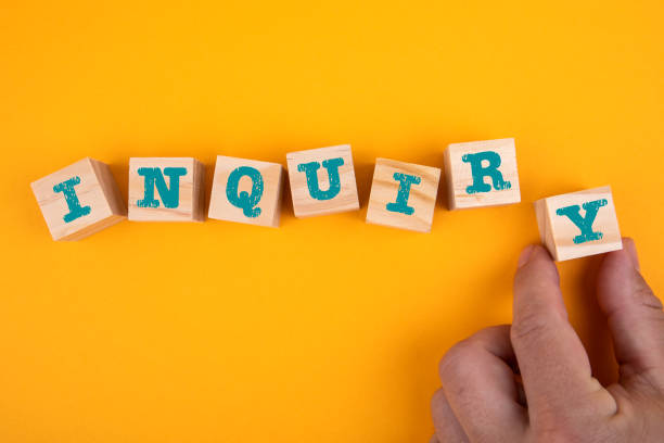istock INQUIRY. Wooden blocks with letters on a yellow background 1330172739