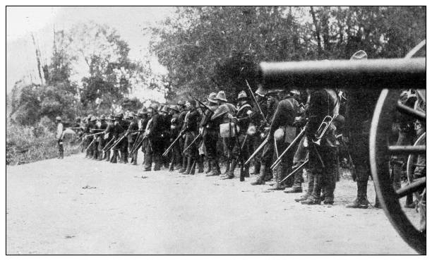Antique black and white photograph: Cease firing, Philippines Antique black and white photograph of people from islands in the Caribbean and in the Pacific Ocean; Cuba, Hawaii, Philippines and others: Cease firing, Philippines firing squad stock illustrations
