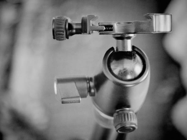 Tripod head for the camera, close-up. A tripod head is the part of a tripod system that attaches the supported device to the tripod legs.