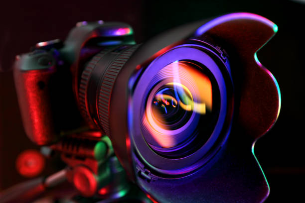 Digital camera Digital camera illuminated with multicolor light. digital single lens reflex camera stock pictures, royalty-free photos & images