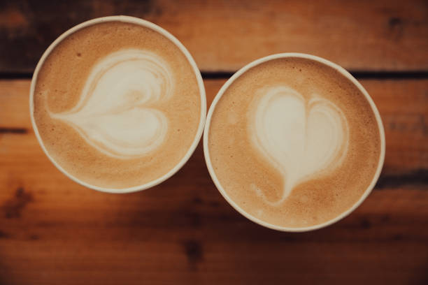 istock Fresh take out coffee with heart shape in foam from above 1330179219