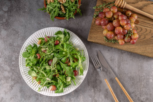 istock Delicious salad made from caramelized roasted grapes, peppery arugula, toasted walnuts, and pecorino cheese. 1330181839