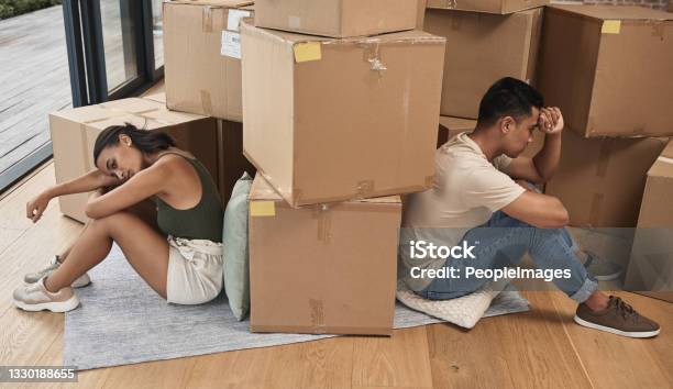 Shot Of A Young Couple Ignoring One Another At Home Stock Photo - Download Image Now