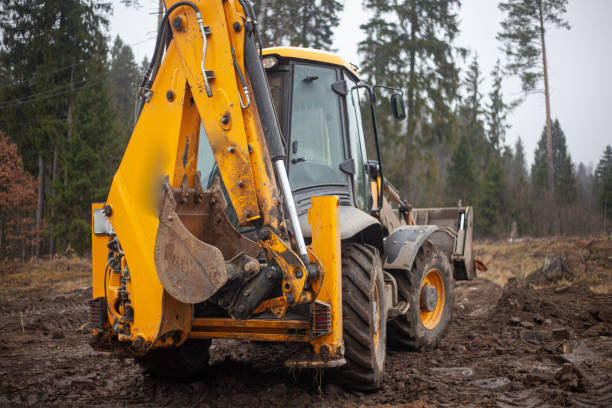 istock The tractor is driving through the mud. Heavy machinery for deforestation. 1330189779