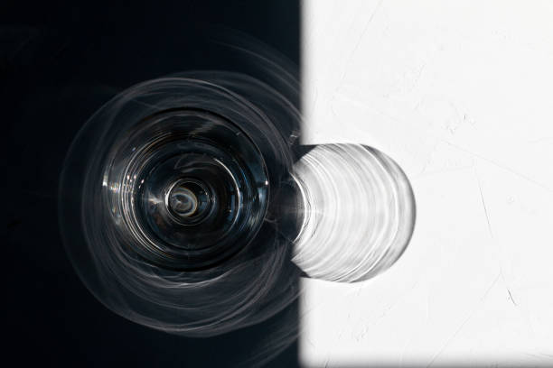 glass seen from above with reflections on green background