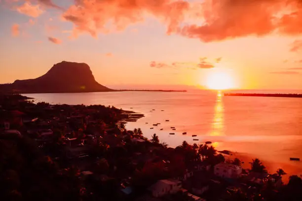 Photo of Aerial view at sunset time with Le Morn mountain in Mauritius.