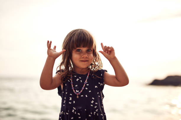 Cute smiley girl posing in front of a camera.