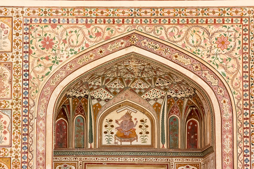 The ornate carvings on the arches of the ancient Amer fort