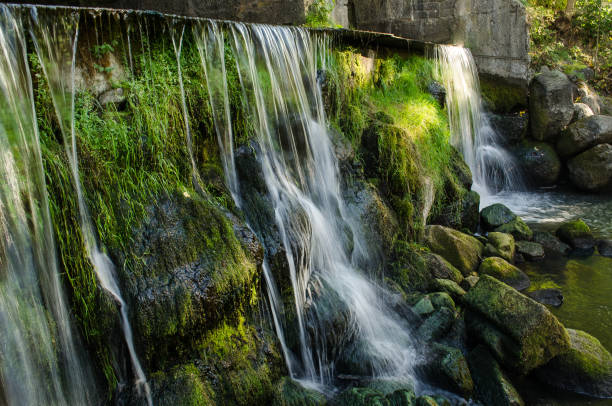 istock Kazdanga village mill locks with a waterfall, Latvia 1330196692