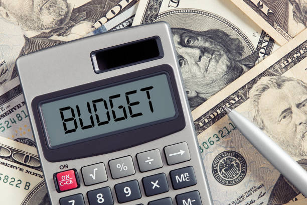 istock The word budget on calculator display with dollar bills backgrou 1330197524