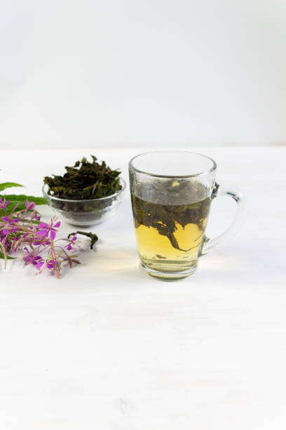 istock Cup of herbal tea with willowherb or chamaenerion on white background 1330197714