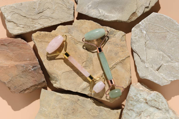 istock Flatlay with modern skin care tools jade and rose quartz roller massagers and guache scraper 1330198832