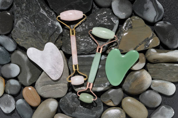 istock Flatlay with modern skin care tools jade and rose quartz roller massagers and guache scraper 1330198950