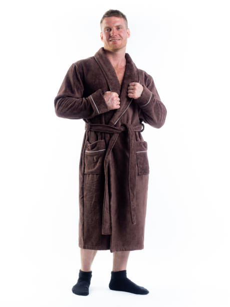 istock strong man in a Bathrobe on an isolated white background with a smile on his face. 1330199144