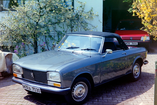 Bavaria, Germany – July 1990. This 304 S Cabriolet, built in 1975, was a success for Peugeot and was noted for several advanced features under its “Pininfarina“ styled exterior. The images were scanned from the 1990's original negative.