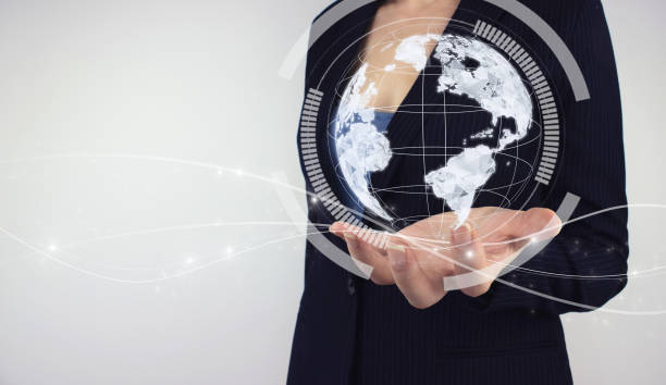 istock Global network concept. Hand hold digital hologram digital planet on grey background. Concept on business, politics, ecology and media, representing global technologies concept 1330203025