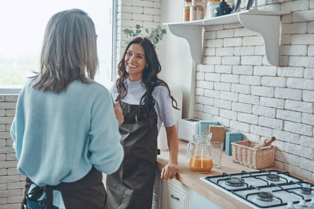 istock Beautiful young woman and her mother communicating 1330203119