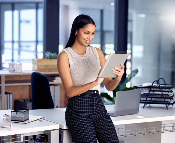 istock Shot of a young businesswoman using her digital tablet at work 1330206083