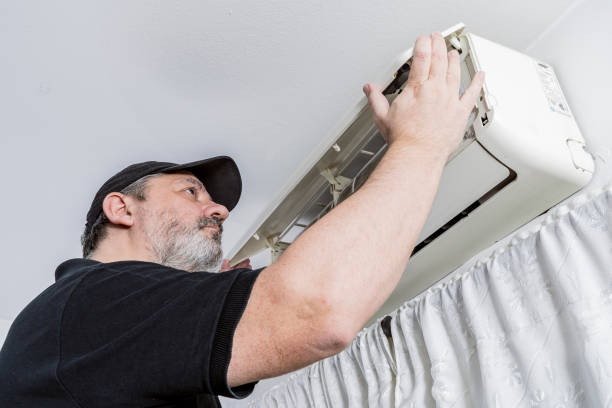istock Professional air conditioning technician checking the cover of an internal unit of a split air unit. Professional job concept 1330208709