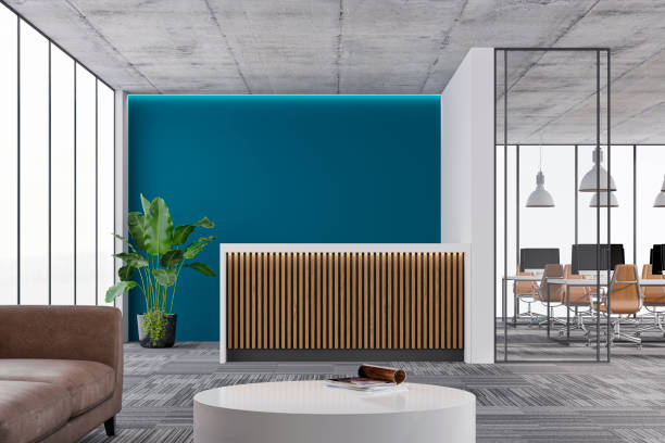 istock Large office interior: a reception desk, a lounge corner with copy space and wordesks behind glass door 1330209458