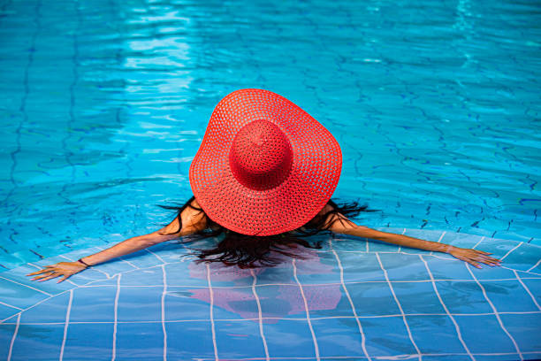 istock Woman relaxing in waterpool 1330210376