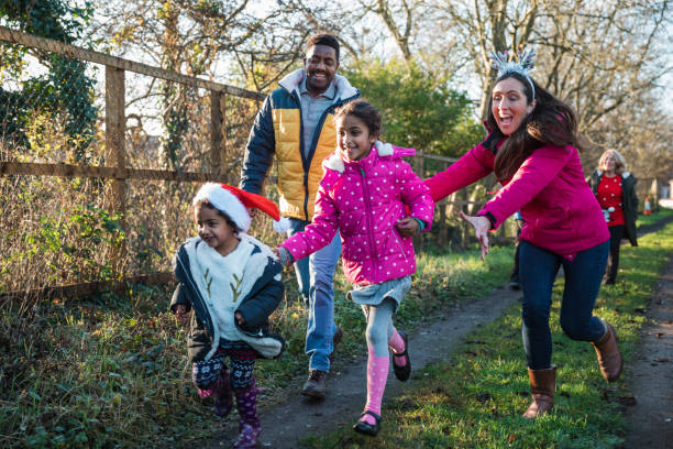 christmas day outdoor fun - family winter walking fun imagens e fotografias de stock