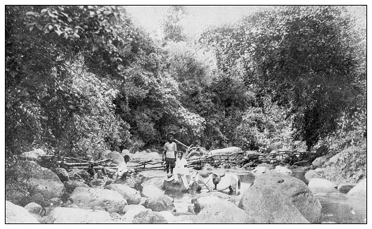 Antique black and white photograph of people from islands in the Caribbean and in the Pacific Ocean; Cuba, Hawaii, Philippines and others: Mountain river, Philippines