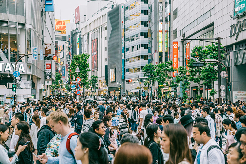 Crowd of people walking in Shibuya district, Tokyo.