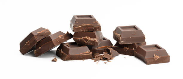 istock broken black chocolate with pieces isolated on white background. Dessert bar of chocolate 1330218528