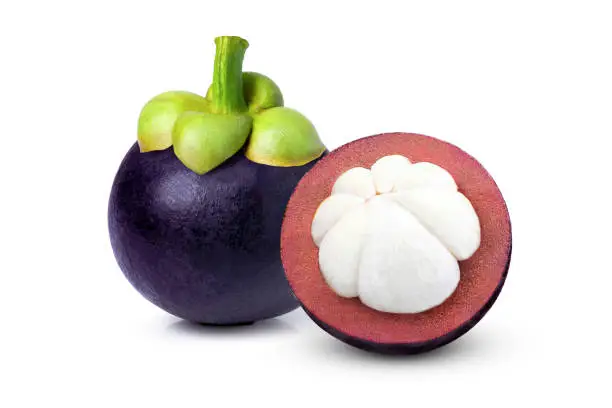 Mangosteen fruit with cut in half sliced isolated on white background.