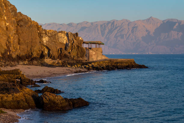 A hut by the sea in Fujairah Old hut by the sea in Fujairah (UAE) in the morning in the rays of the dawn sun fujairah stock pictures, royalty-free photos & images