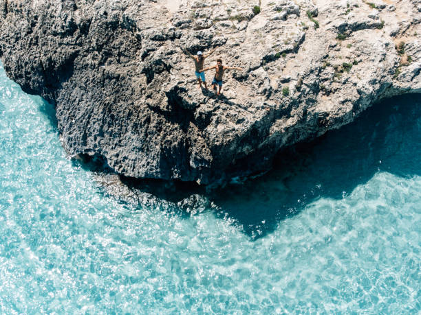 istock Two friends are looking up, saying hello to the drone 1330224101