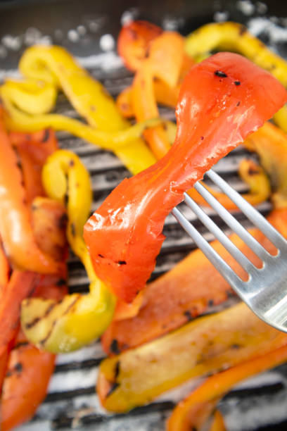 istock Preparation of a dish based on grilled colored peppers 1330226702
