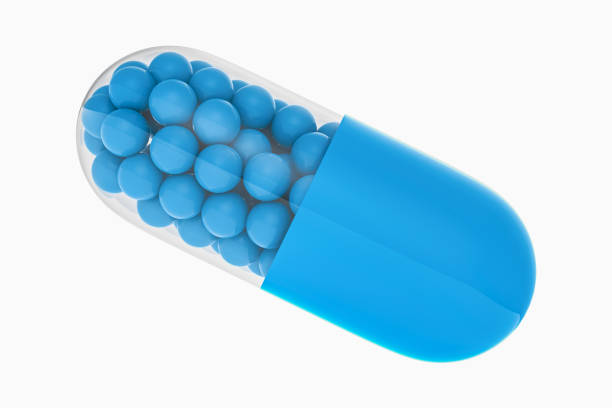 большая синяя таблетка с лекарством или витамином на белом фоне. иллюстрация 3d-рендеринга - vitamin a vitamin b complex pill bottle medicine стоковые фото и изображения