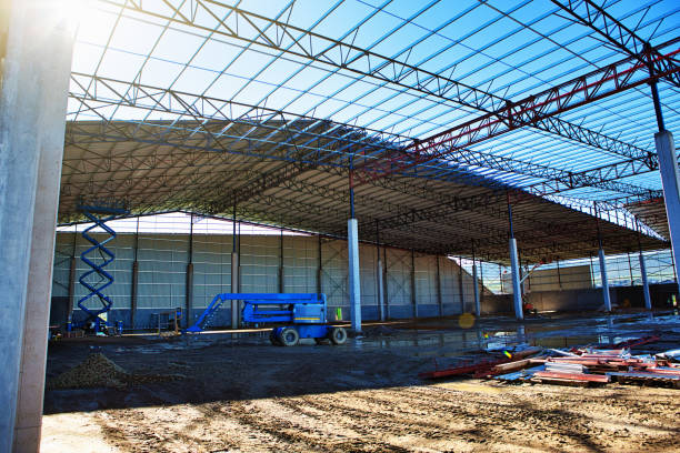 istock View into a large warehouse under construction, with mobile crane in the distance 1330231349