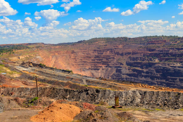 istock Huge iron ore quarry with working dump trucks and excavators in Kryvyi Rih, Ukraine 1330235372