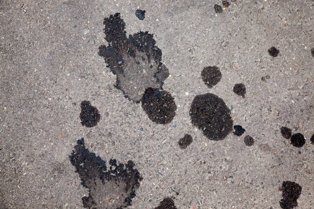 istock car oil stains on an asphalt road 1330237104