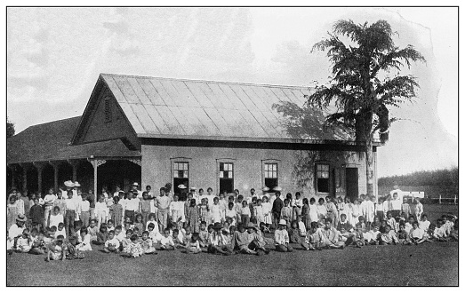 Antique black and white photograph of people from islands in the Caribbean and in the Pacific Ocean; Cuba, Hawaii, Philippines and others: Public School, Kauai, Hawaii