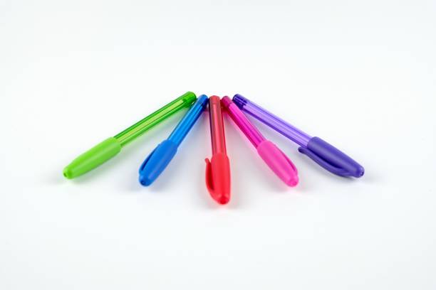 istock Close-up of five colored pens on white background 1330237849