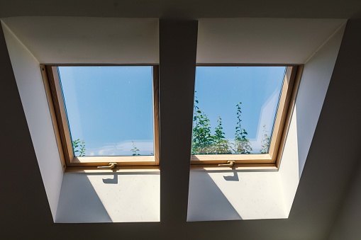 Roof windows provide sunlight on a sunny day.