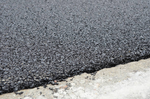 istock Layer of fresh hot asphalt texture 1330242623