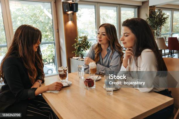 Enjoying Hot Chocolate In Great Company Stock Photo - Download Image Now - Adult, Adults Only, After Work
